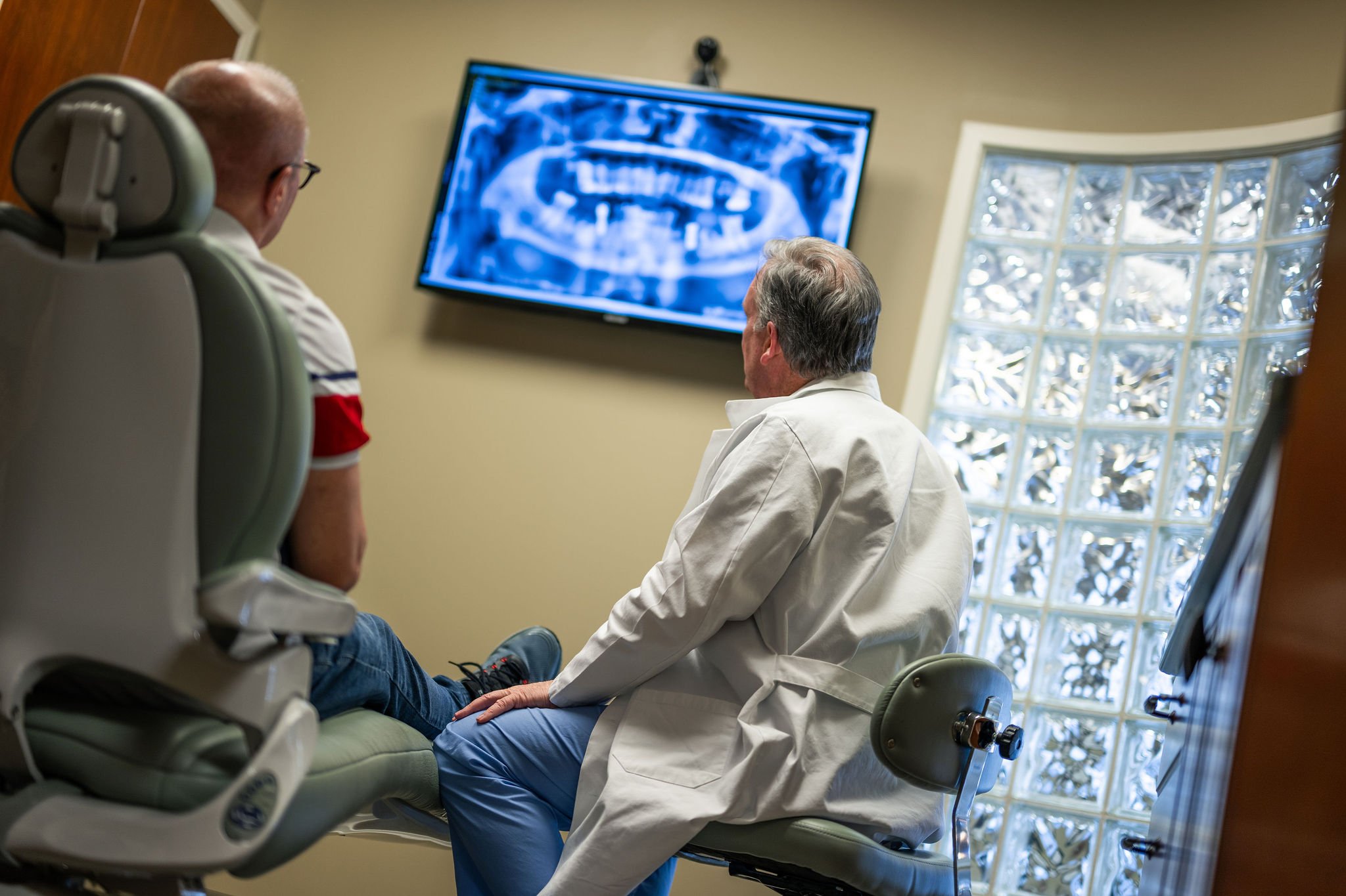 Dr. Haigney explaining dental implants process | Lake Norman Oral & Facial Surgery, Huntersville, NC